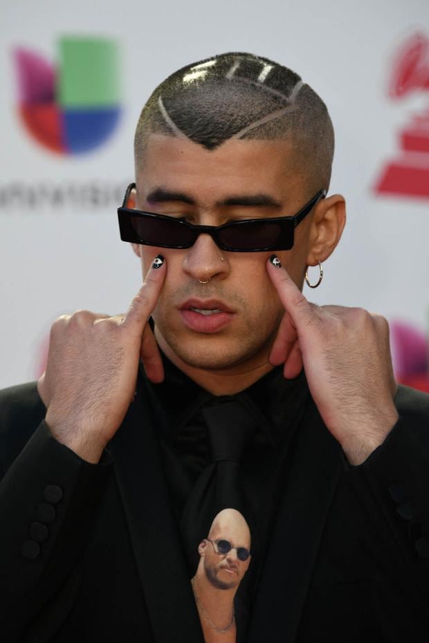 Bad Bunny attended the 2018 Latin Grammy Awards wearing a tie with the face of wrestling icon Stone Cold.  (Photo by Bridget Bennett / AFP)