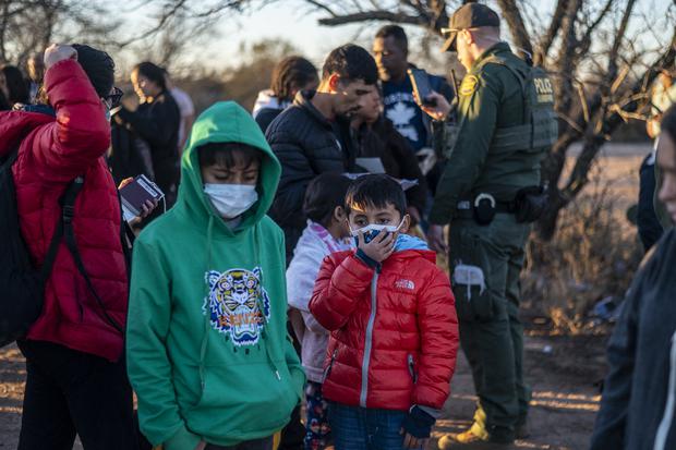 A group of migrants is processed by the Border Patrol after crossing without documents in Eagle Pass, Texas, on February 4, 2024. (Photo by SERGIO FLORES/AFP).