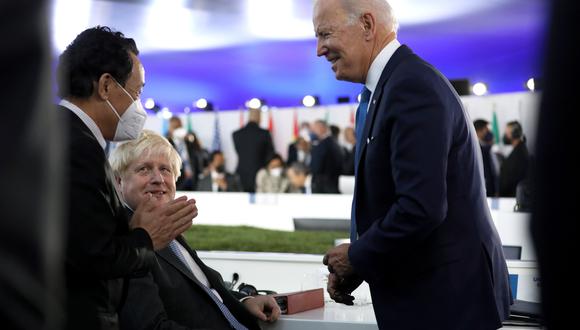 Imagen del G20 en Roma: Qu Dongyu, director de la Food and Agriculture Organization, junto al primer ministro de Inglaterra, Boris Johnson, y al presidente de Estados Unidos, Joe Biden. Bloomberg