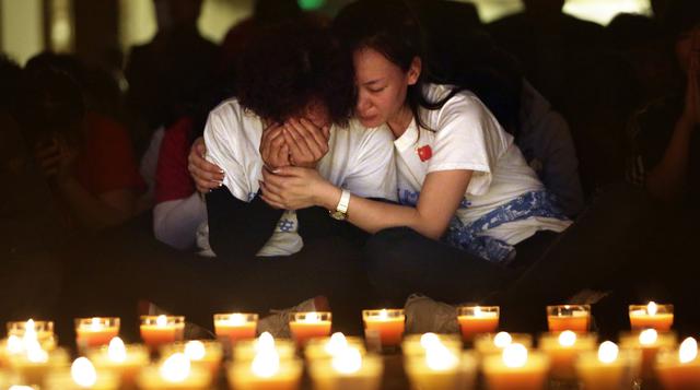 La angustia de las familias del MH370 a un mes de desaparecido  - 1