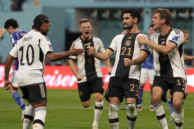 Germany's Ilkay Gundogan, second right, celebrates with his teammates after scoring his side's opening goal during the World Cup group E soccer match between Germany and Japan, at the Khalifa International Stadium in Doha, Qatar, Wednesday, Nov. 23, 2022. (AP Photo/Luca Bruno)