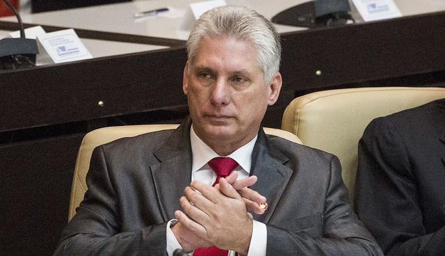 Cuba's new president Miguel Diaz-Canel applauds, after being elected as the island nation's new president, at the National Assembly in Havana, Cuba, Thursday, April 19, 2018. Raul Castro left the presidency after 12 years in office when the National Assembly approved Diaz-Canel's nomination as the candidate for the top government position. (AP Photo/Desmond Boylan)