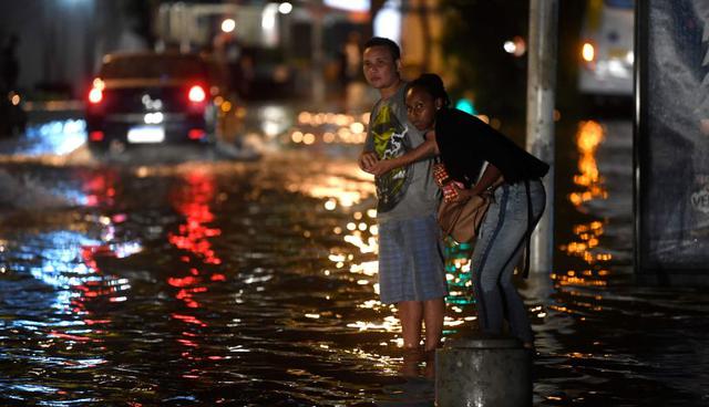 Varias calles que suben desde la playa de Botafogo sufrieron inundaciones, con árboles caídos y embotellamientos. (Foto: AFP)