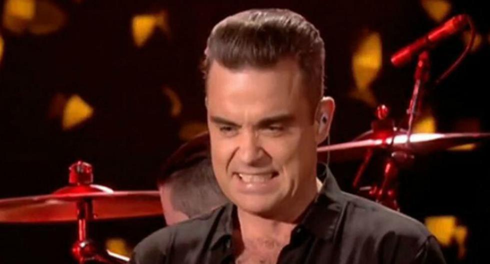 Mira cómo reaccionó Robbie Williams tras tocar a sus fans. (Foto: Captura YouTube)
