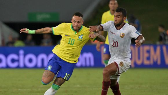 Brazil's forward Neymar (L) and Venezuela's midfielder Cristian Casseres Jr fight for the ball during the 2026 FIFA World Cup South American qualification football match between Brazil and Venezuela at the Arena Pantanal stadium in Cuiaba, Mato Grosso State, Brazil, on October 12, 2023. (Photo by NELSON ALMEIDA / AFP)