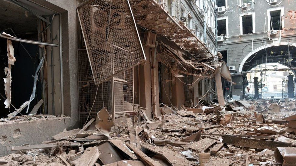 The image shows the damage to the entrance of a building in Kharkiv, caused by the Russian attack.  (GettyImages).