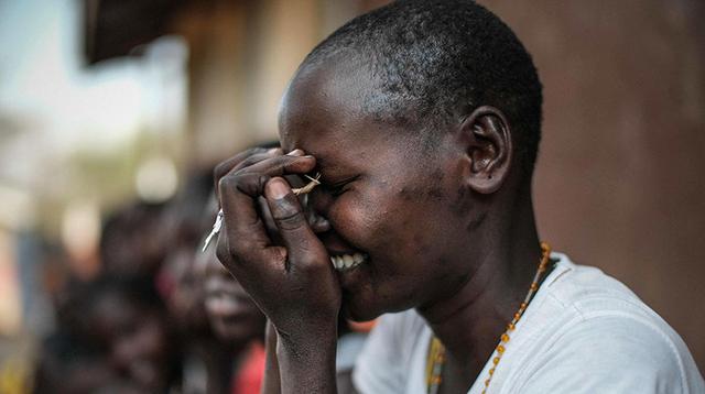 A student of Kalas Girl's primary school, which hosts escaped girls from female genital mutilation (FGM) and child marriage, reacts in Amudat town, northeast Uganda, on January 31, 2018.  The UN estimates that over 200 million girls and women have experienced FGM which is a life-threatening procedure that involves the partial or total removal of a woman's external genitalia. February 6, 2018, marks the 6th International Day of Zero Tolerance for FGM. / AFP / Yasuyoshi CHIBA