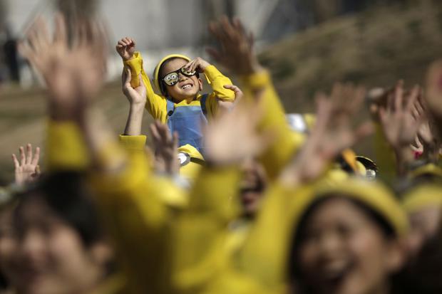 Participants of a marathon dress up as 'minions' in Tokyo on February 13, 2016. The event involved 10,000 runners.  want to ran a kilometer to raise money for charities benefiting boys and girls.  (Photo: AP/Eugene Hoshiko)