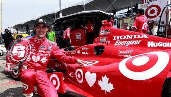 TORONTO, ON - JULY 12:  Dario Franchitti of Scotland, driver of the #10 Target Chip Ganassi Racing Honda poses with the Verizon P1 Pole Award following qualifying for the IZOD INDYCAR Series Honda Indy Toronto on July 12, 2013 in Toronto, Canada.  (Photo