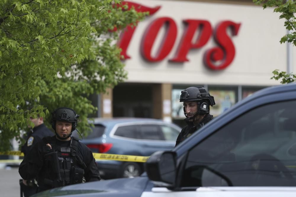 Police secure a perimeter after a shooting at a supermarket in Buffalo, New York.  (AP Photo/Joshua Bessex)