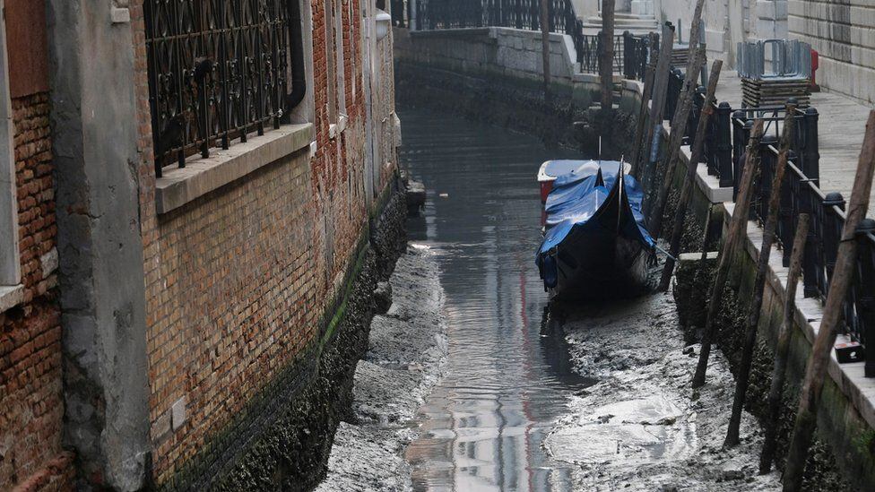 Many gondolas have been stranded at the bottom of the canals.  (REUTERS).