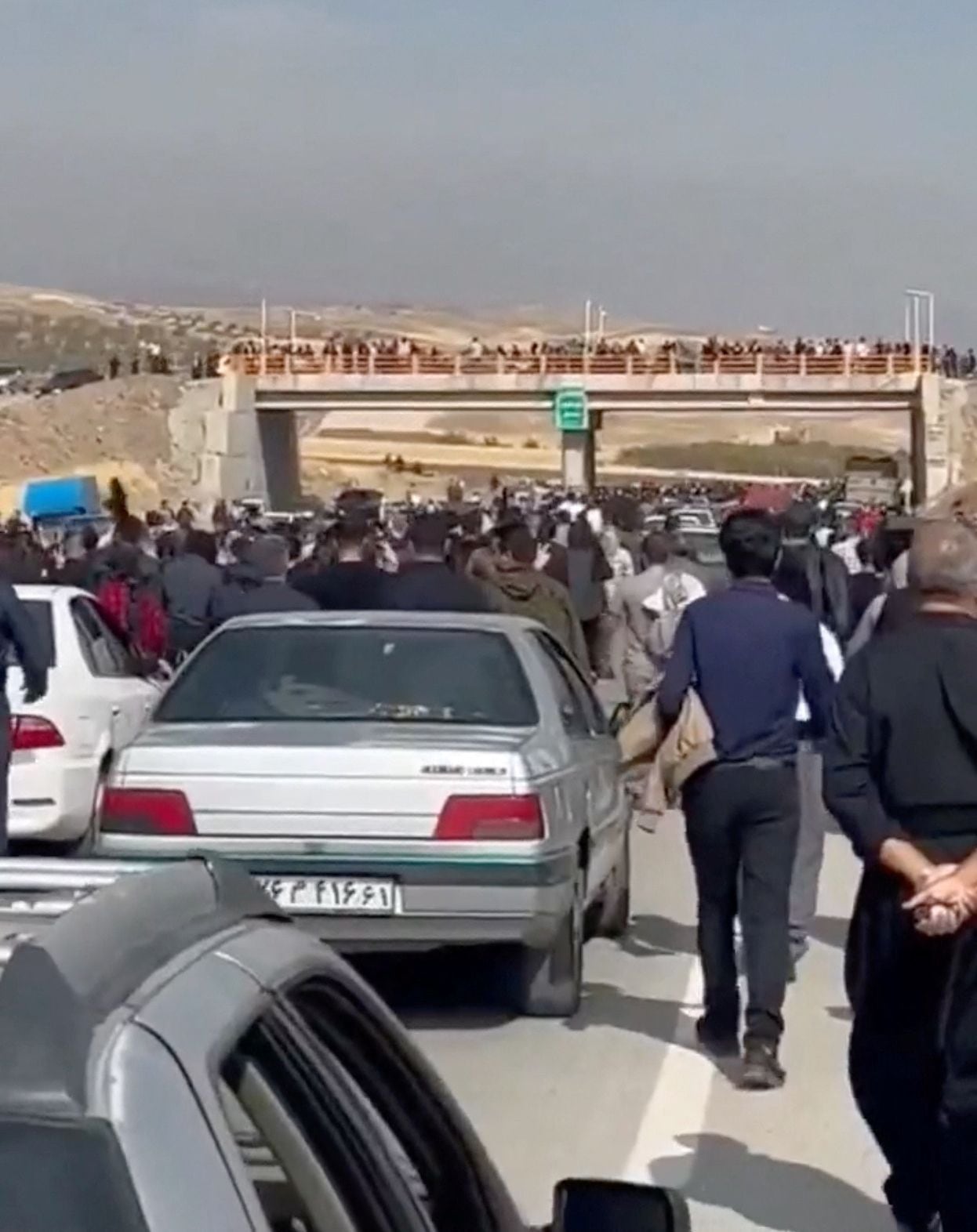 Some 10,000 people marched Friday in Saqqez, in Iranian Kurdistan, to the cemetery where Mahsa Amini was buried, in another open challenge to the regime.