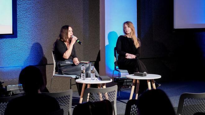 Mariana Savka (left), a Ukrainian writer, with Victoria Amelina during the Lviv Book Forum last October.  (GETTY IMAGES).
