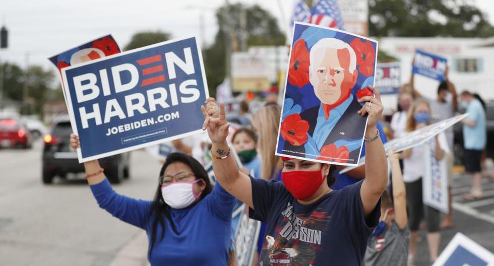Partidarios del presidente electo de Estados Unidos Joe Biden celebran frente a la oficina de campaña Casa Biden en Tampa, Florida. (Foto: Octavio Jones / Getty Images / AFP)