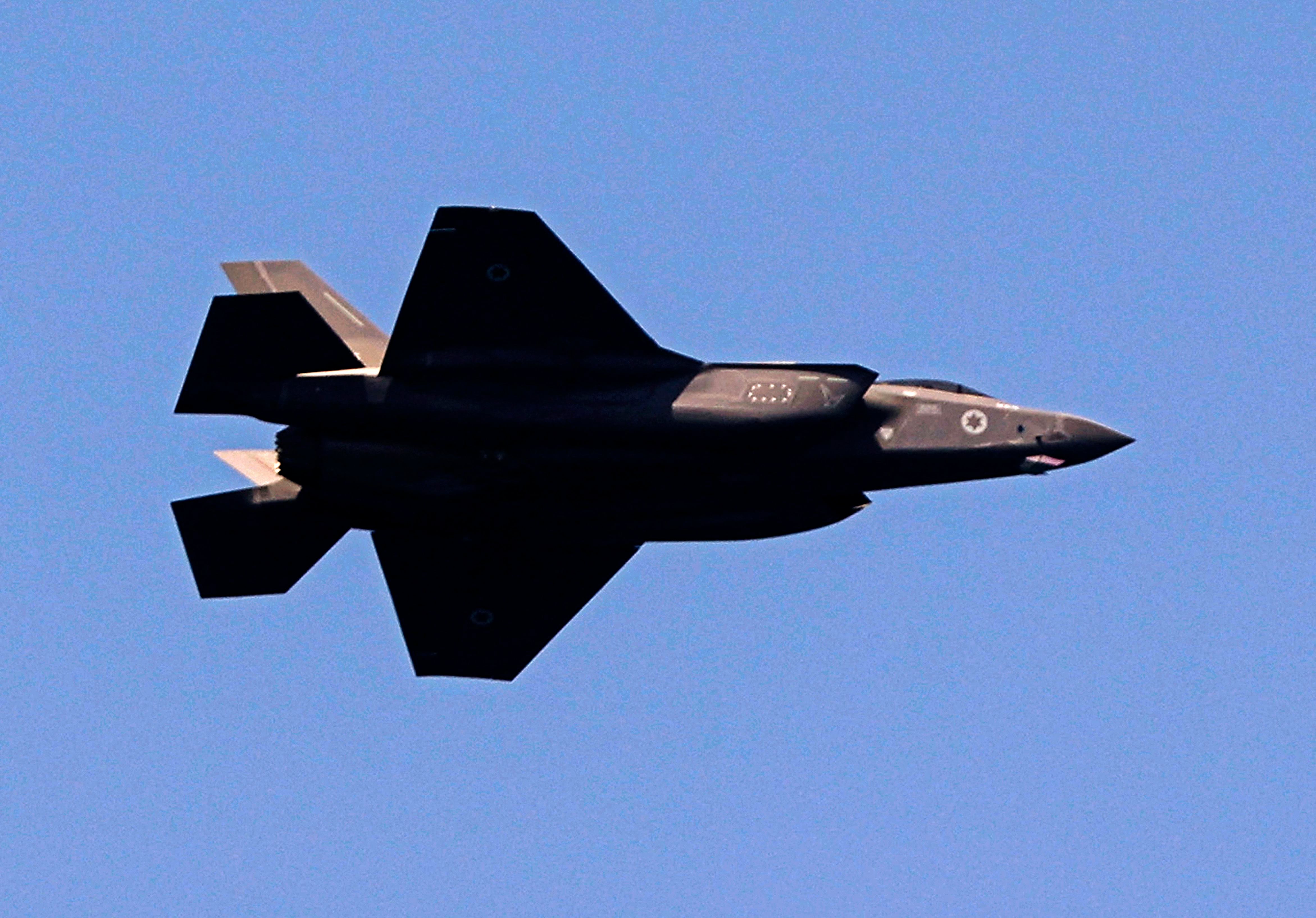 An Israeli F-35 fighter jet flies over the Mediterranean coastal city of Tel Aviv during the country's 73rd Independence Day celebrations, on April 15, 2021. (Photo by JACK GUEZ/AFP).