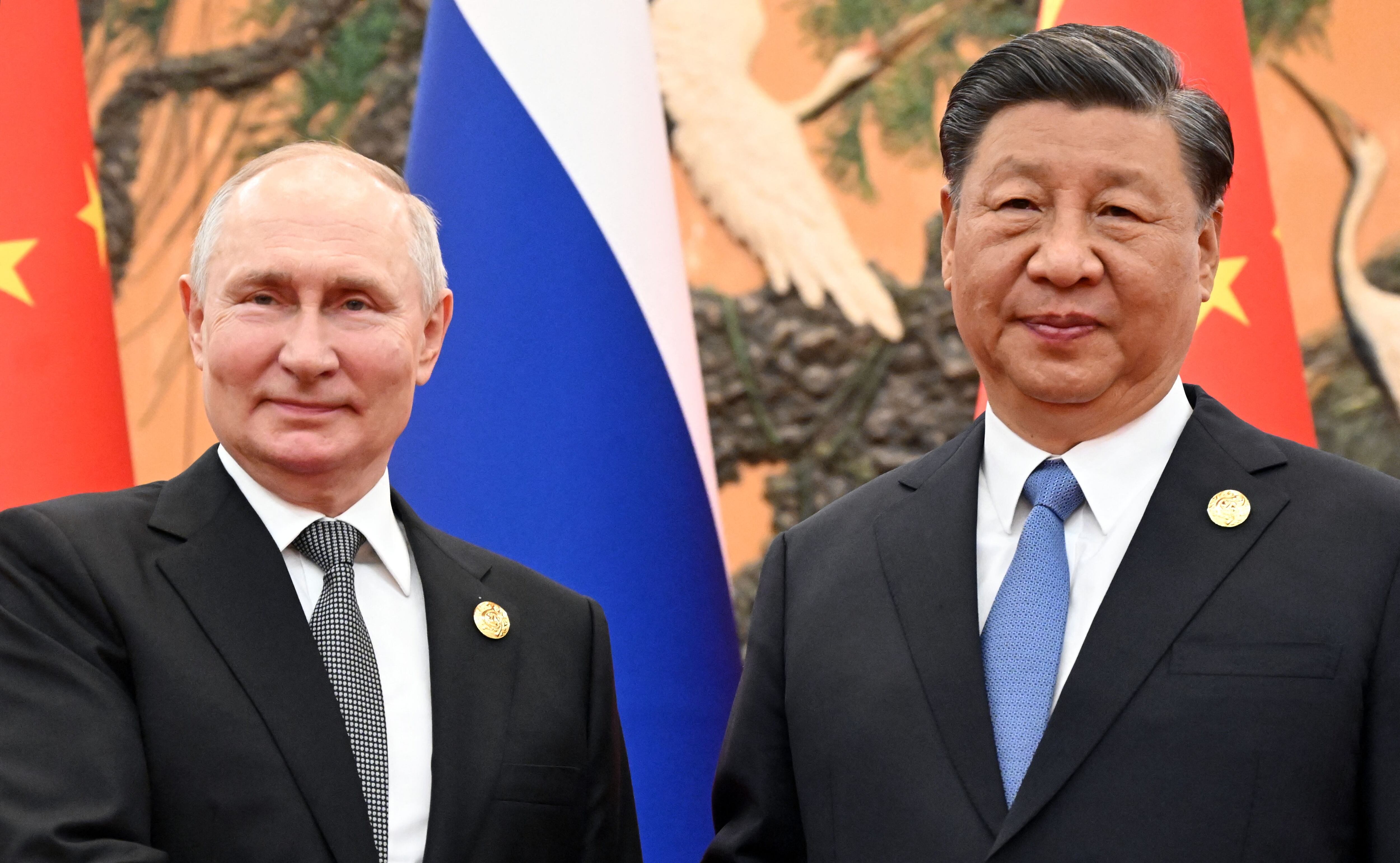 Russian President Vladimir Putin and Chinese President Xi Jinping pose during a meeting in Beijing on October 18, 2023. (Photo by Sergei GUNEYEV/POOL/AFP).