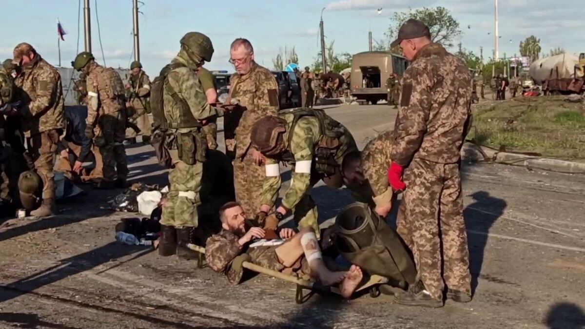 Ukrainian soldiers are searched by pro-Russian military personnel after leaving the besieged Azovstal steel plant in the Ukrainian port city of Mariupol.  (AFP).