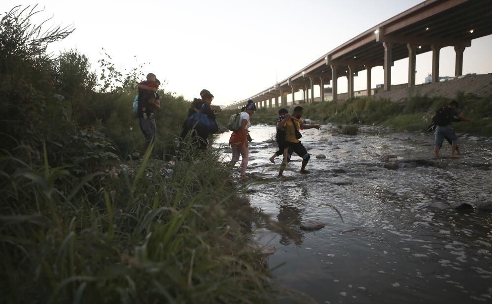 Venezuelan migrants cross the Rio Grande to the US border to surrender to border patrol, from Ciudad Juarez, Mexico.
