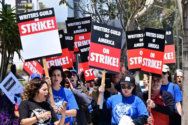 Members of the Writers Guild of America began their indefinite strike.  (Photo: Frederic J. Brown / AFP)