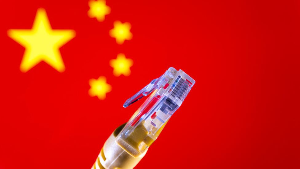 An ethernet cable in front of a Chinese flag