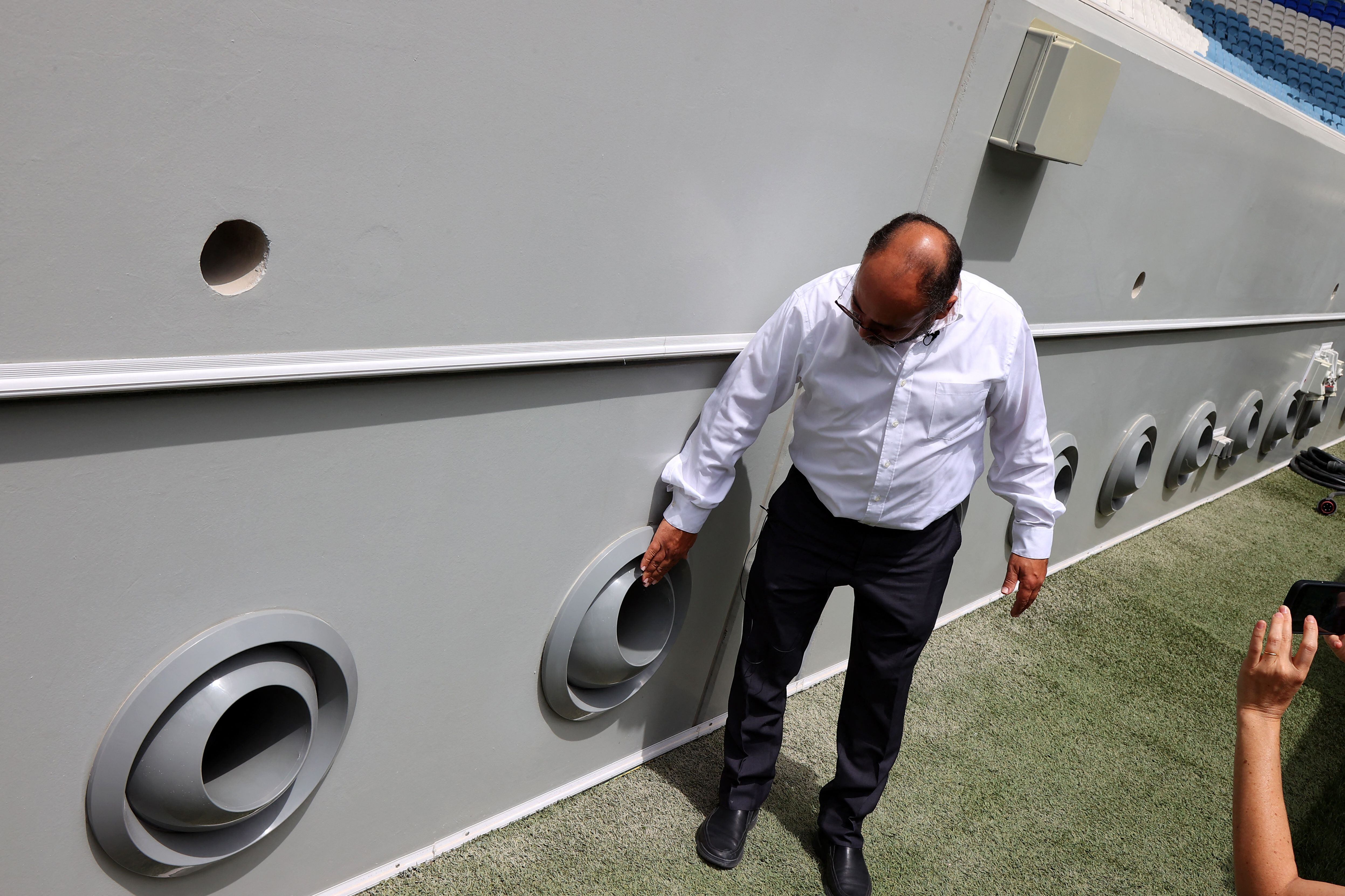 Dr. Saud shows the air conditioning nozzles on the sides of the pitches in the Qatar 2022 stadiums.