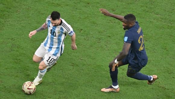 Argentina's forward #10 Lionel Messi vies with France's forward #26 Marcus Thuram during the Qatar 2022 World Cup final football match between Argentina and France at Lusail Stadium in Lusail, north of Doha on December 18, 2022. (Photo by Antonin THUILLIER / AFP)