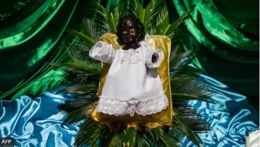The black Child God doll is a central part of the Christmas celebrations in Quinamayó.  (AFP)