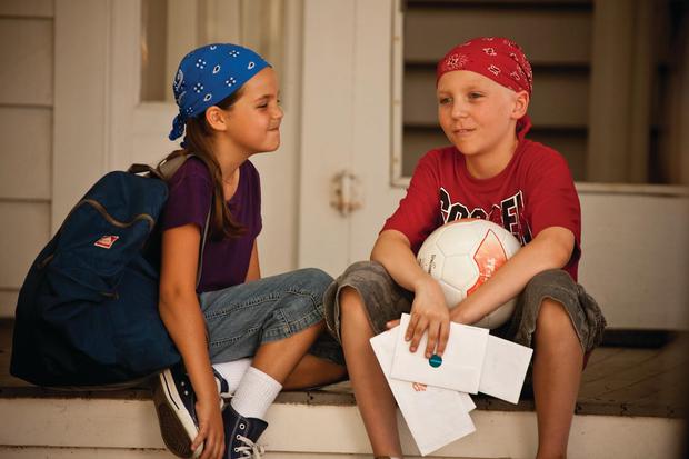 Tyler Doherty (Tanner Maguire) shows his cards to his girlfriend Samantha Berryfield (Bailee Madison) in the movie "Messages to God" (Image: Probability Pictures)