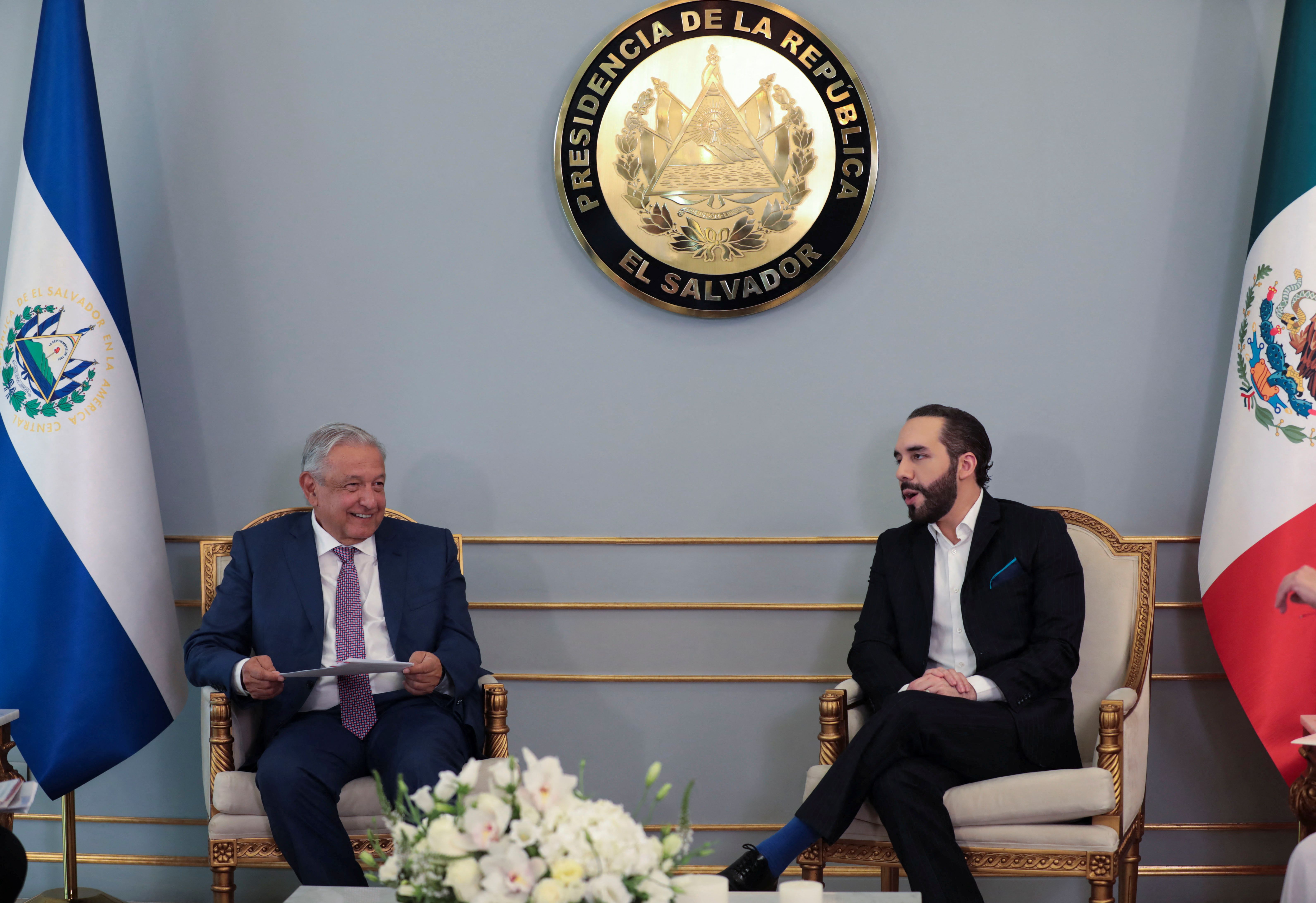The President of Mexico, Andrés Manuel López Obrador, speaks with the President of El Salvador, Nayib Bukele, during a private meeting at the Presidential House, during Obrador's visit to San Salvador, El Salvador.