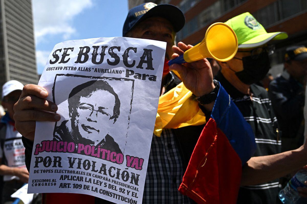 Protesters march against the government of Colombian President Gustavo Petro for health and pension reforms in Bogotá, March 6, 2024. (Photo by Raul ARBOLEDA / AFP)