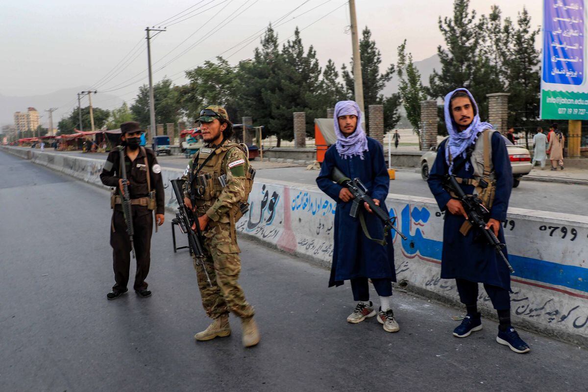 The Taliban stand guard in front of Kabul University in Kabul, Afghanistan, on December 21, 2022. (Photo by EFE/EPA/STRINGER)