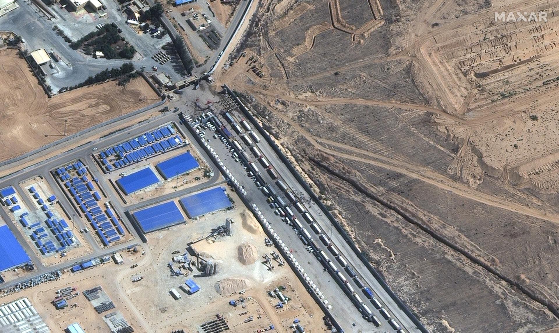 A satellite image provided by Maxar Technologies shows aid trucks waiting on the Egyptian side of the Rafah border crossing between Egypt and the Gaza Strip on October 20, 2023. (AFP).