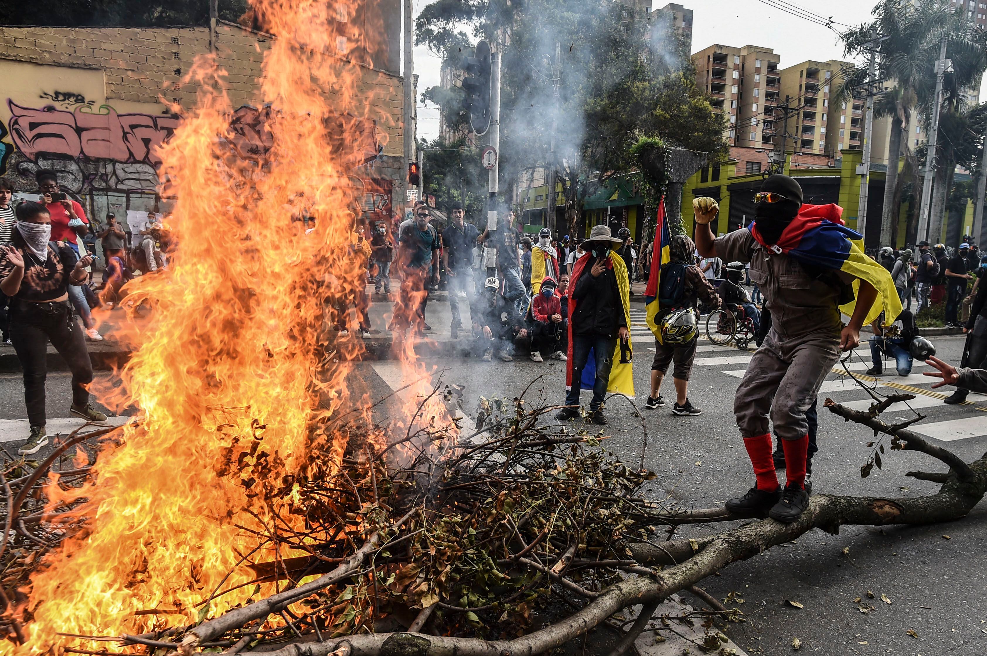 Colombian riot police arrest a protester during a demonstration against the government of Colombia's President Iván Duque, in Bogota, on January 21, 2020.