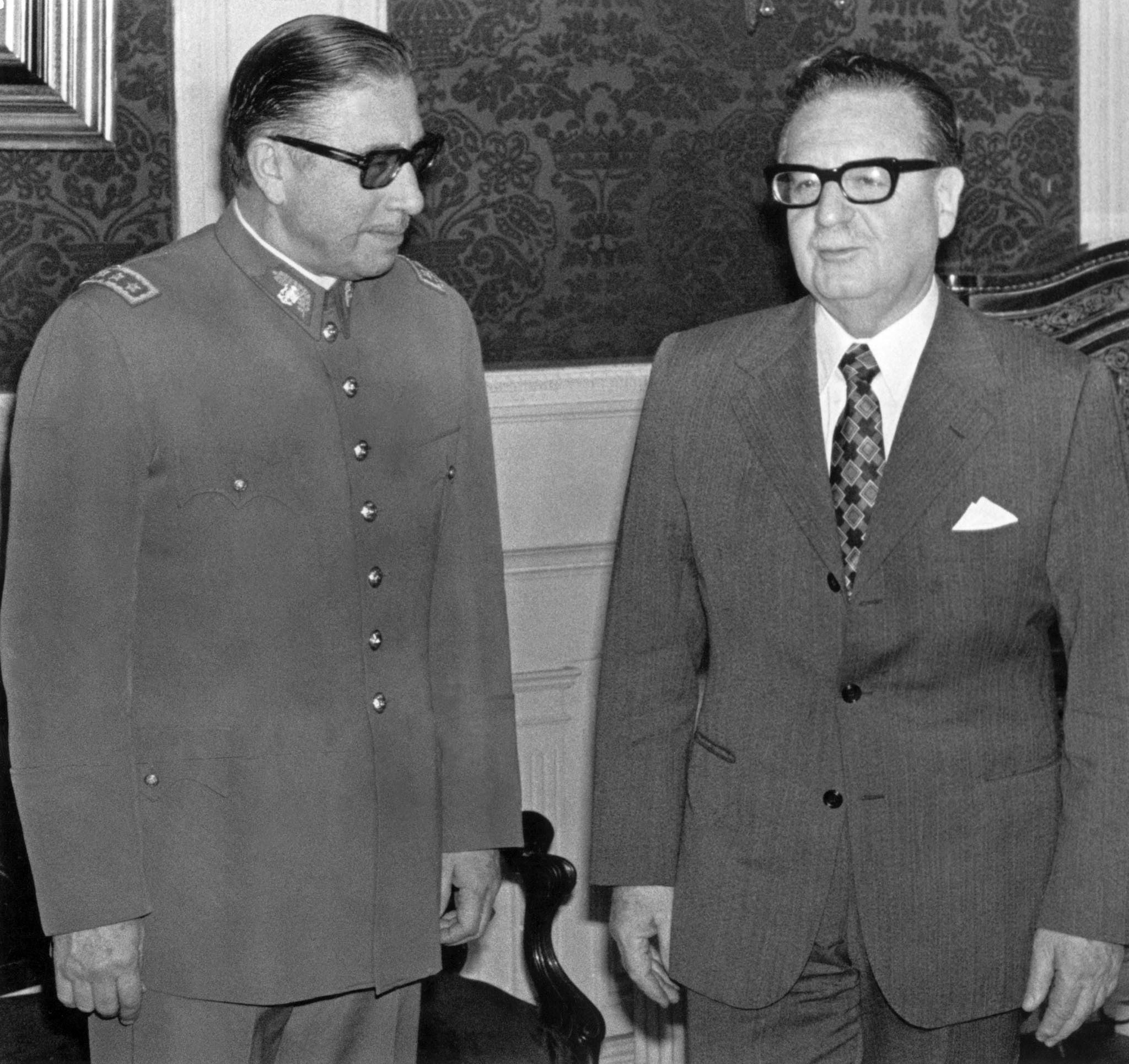 General Augusto Pinochet (left) poses with Chilean President and Marxist leader Salvador Allende in Santiago on August 23, 1973, shortly after Allende appointed him head of the army.  (AFP photo).