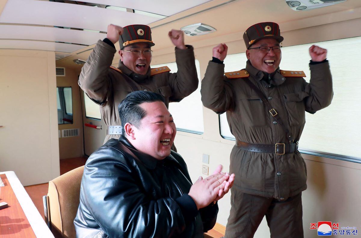 Kim Jong-un celebrates the test launch of a new ICBM intercontinental ballistic missile.  (AFP).