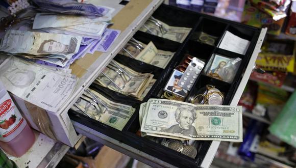 DolarToday en Venezuela: Revisa AQUÍ la cotización del dólar hoy, domingo 19 de febrero del 2023 | (Photo by Cristian HERNANDEZ / AFP)