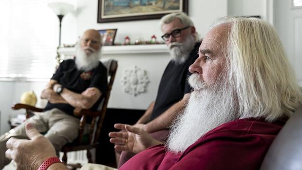 Three people who play Santa Claus telling their stories.  (JUAN CAMILO ROA @JUANCAMILOBERLIN).