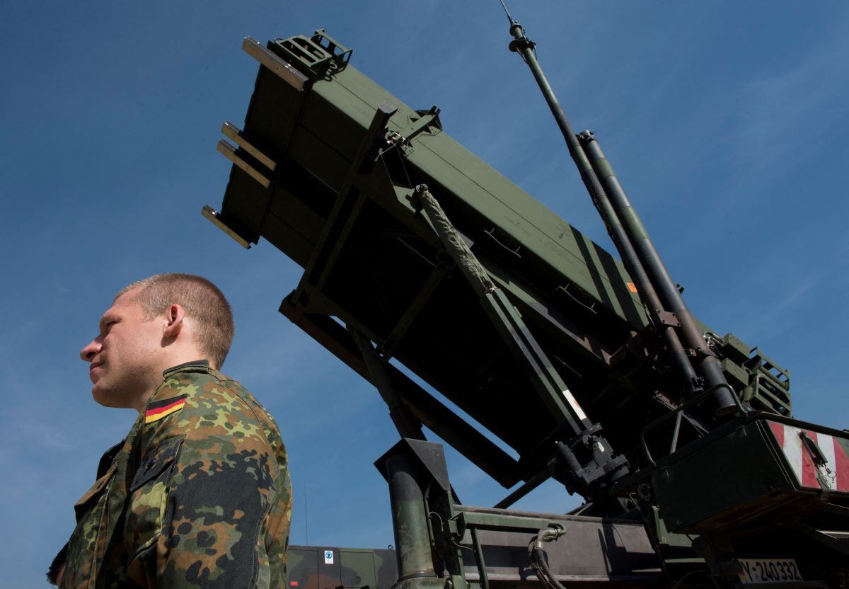 In this file photo taken on March 25, 2014, German soldiers stand to attention in front of a Patriot missile launcher at the Gazi barracks in Kahramanmaras, southern Turkey.  (JOHN MACDOUGALL / AFP).