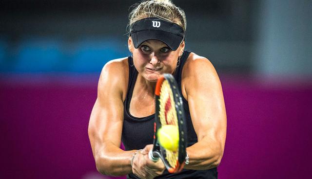 Kateryna Kozlova of Ukraine hits a return against Zhang Shuai of China during their women's singles quarter-final match at the WTA Guangzhou Open tennis tournament in Guangzhou, southern China's Guangdong province on September 21, 2017. China OUT
 / AFP / STR