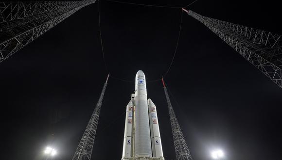 In this picture released by NASA, Arianespace's Ariane 5 rocket with NASA�s James Webb Space Telescope onboard, is seen at the launch pad,on December 23, 2021, at Europe�s Spaceport, the Guiana Space Center in Kourou, French Guiana. - The telescope, the most powerful space observatory ever built, is now tentatively set for launch on Christmas Day, after decades of waiting. An engineering marvel, it will help answer fundamental questions about the Universe, peering back in time 13 billion years. Here are five things to know. (Photo by Bill INGALLS / NASA / AFP) / RESTRICTED TO EDITORIAL USE - MANDATORY CREDIT "AFP PHOTO / NASA/Bill Ingalls" - NO MARKETING - NO ADVERTISING CAMPAIGNS - DISTRIBUTED AS A SERVICE TO CLIENTS