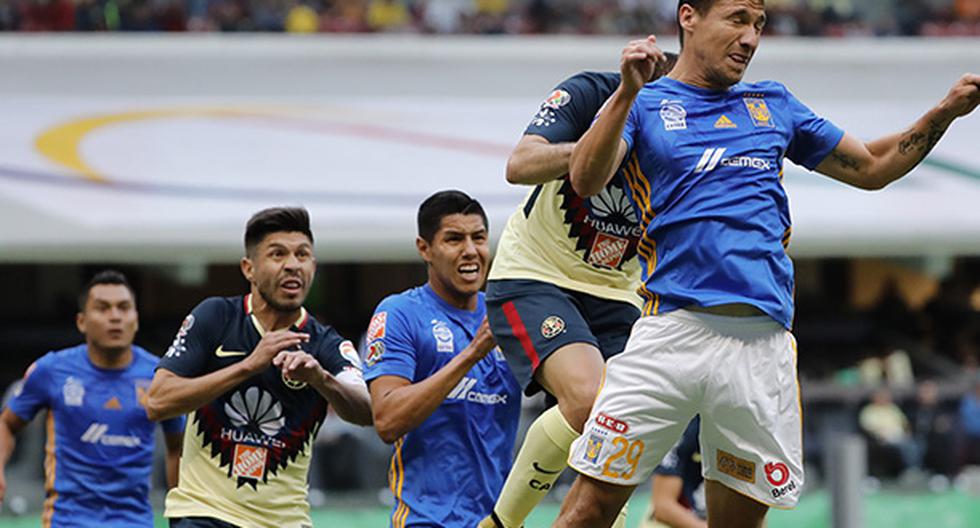 En un intenso partido, América y Tigres igualaron a dos goles por bando en el estadio Azteca. (Foto: EFE)