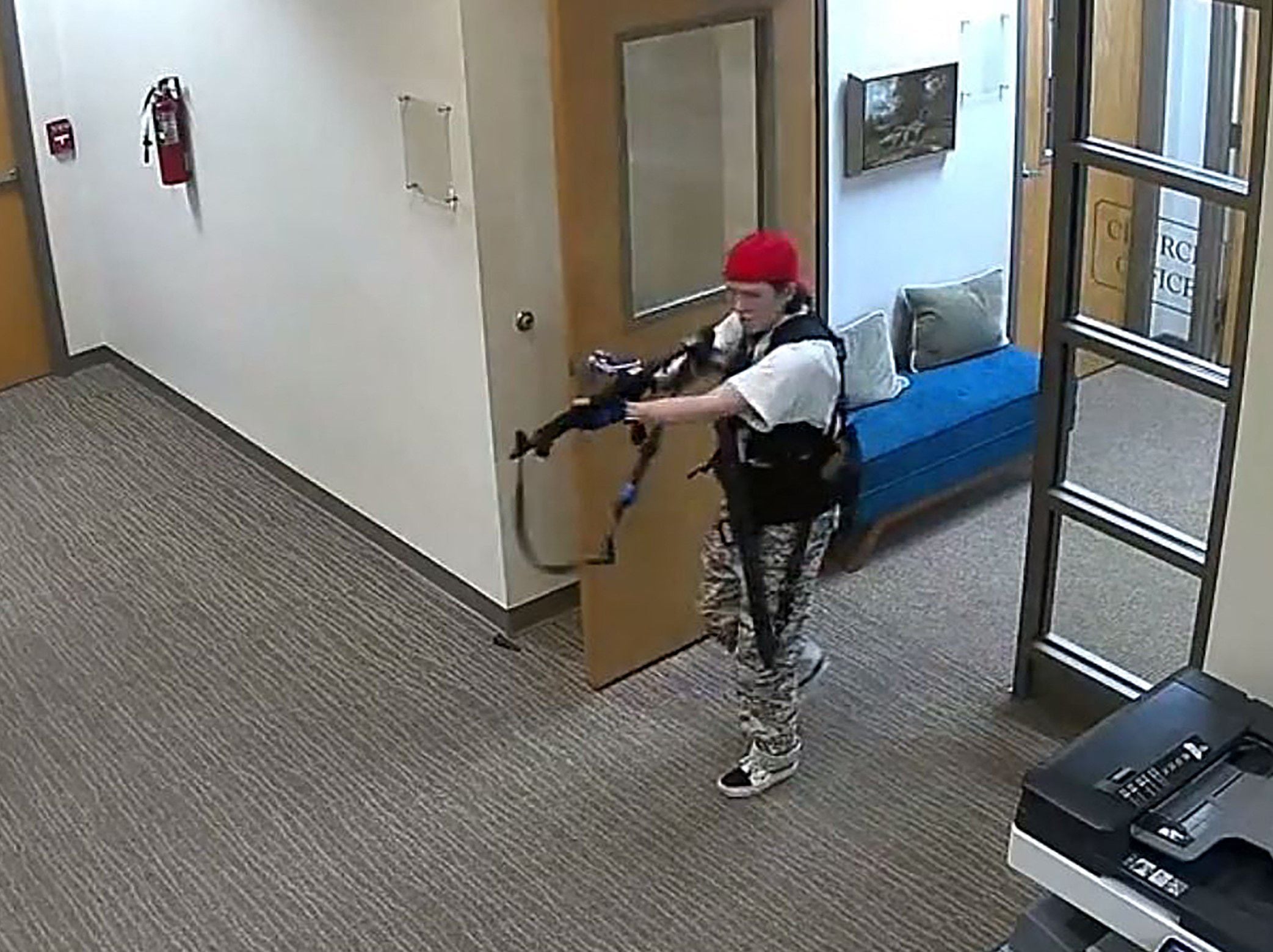 This video still image courtesy of the Metropolitan Nashville Police Department shows Audrey Hale holding an assault rifle in the Covenant School building.  (AFP).