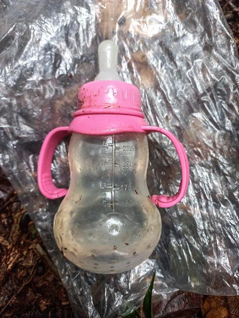 A baby bottle found in the woods while searching for the children.  (AFP).