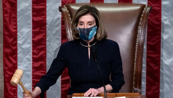 La presidenta de la Cámara de Representantes, Nancy Pelosi, dirige la votación sobre el impeachment a Donald Trump. (Foto de SAUL LOEB / AFP).