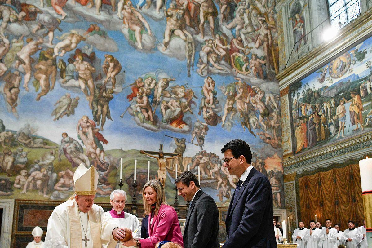 Pope Francis performing a series of baptisms during the Feast of the Baptism of the Lord in the Sistine Chapel in the Vatican.  (Photo by The Vatican Media / AFP)