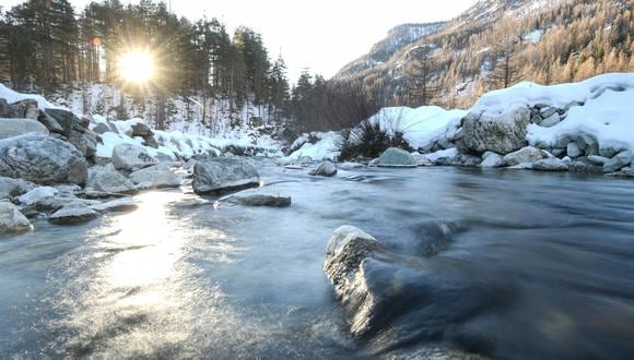 This photograph taken in Casterino, in the French Alps, on December 31, 2021 shows the river near the village. - At an altitude of 1,550 metres in the French Alps, near the Italian border, it takes an hour's walk on a damaged and snowy road to reach Casterino, the last remote hamlet after the deadly floods of October 2020 when Storm Alex hit France on October 2, 2020, bringing powerful winds and rain across the country and left at least seven dead before moving into northern Italy. (Photo by Piero CRUCIATTI / AFP)