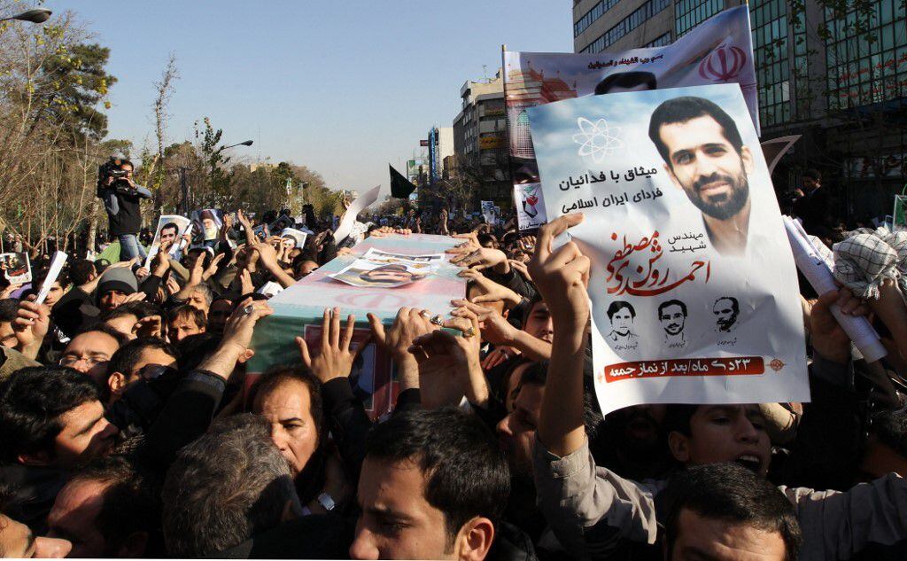 The coffin of Iranian scientist Mostafa Ahmadi-Roshan is carried through the streets of Tehran during his funeral two days after his assassination in January 2012. 