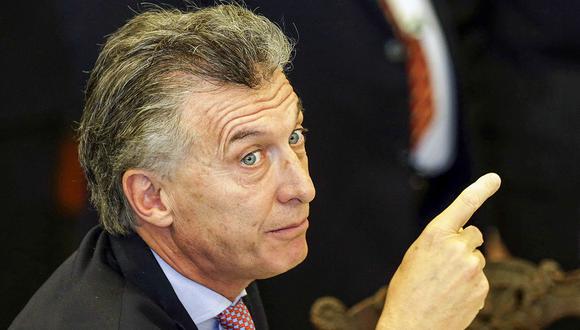 Argentine President Mauricio Macri points during the lunch of the Mercosur and Associated States Summit of Heads of State, at the Itamaraty Palace, in Brasilia, Brazil, Thursday, Dec. 21, 2017. (AP Photo/Eraldo Peres)