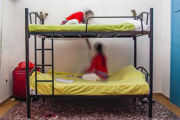 Temporary apartments in Greece are simple, equipped with bunk beds, a table and chairs.