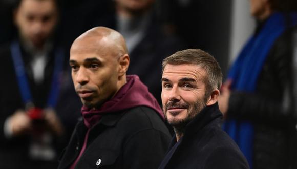French football coach and former player, Thierry Henry (L) and British football star David Beckham are seen in the stands before the UEFA Champions League 1st round group F football match between AC Milan and Paris Saint-Germain at the San Siro stadium in Milan on November 7, 2023. (Photo by Marco BERTORELLO / AFP)